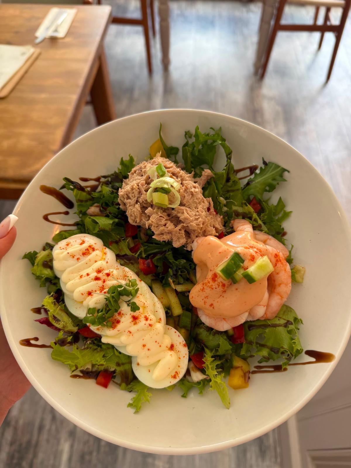 Fresh salad bowl with tuna, prawns and egg